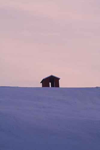 Stuga på snötopp
