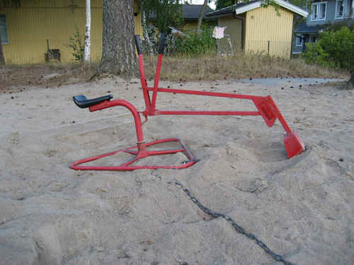 En grävskopa i sandlåda